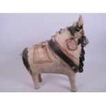 A terracotta pourer in the form of a cow with slip glazed decoration, possibly Indus Valley, 12"