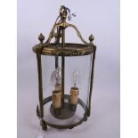 An Empire style cylindrical porch lantern with brass frame and glass panels, A/F, 15" high, 8"