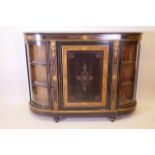 A C19th aesthetic style ebonised and inlaid credenza, with ormulu mounts and glazed bow shaped ends,