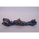 A Chinese blue, white and red porcelain ruyi in the form of a fruiting branch, 12" long