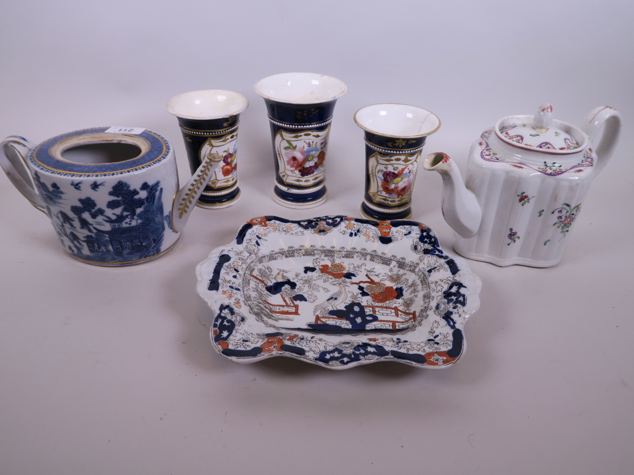 An C18th English creamware teapot painted with garlands and flowers, 6" high, together with an early