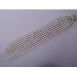 Eight strings of faux pearl beads, 17" long