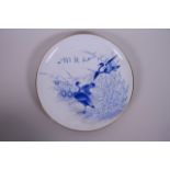 An Oriental blue and white porcelain cabinet plate with a gilt rim and waterfowl decoration,