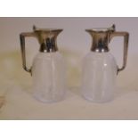 A pair of mid C20th pressed glass claret jugs with silver plated mounts, 8" high