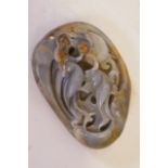 A Chinese jade ornament carved with two birds and a lotus, 4" long