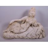 A carved marble figurine of a reclining Quan Yin, A/F, 16" long