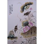 A Chinese polychrome porcelain plaque decorated with birds amongst lotus flowers, 10" x 14"