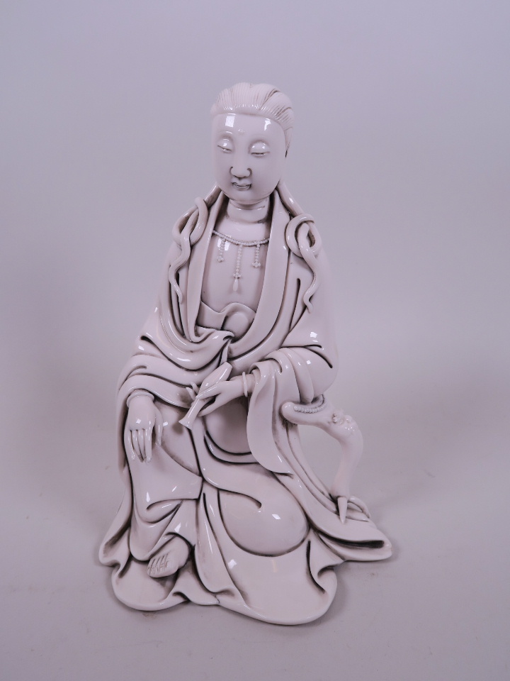 A Chinese blanc de Chine figure of Quan Yin, impressed seal mark verso, 8" high