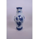 A Chinese blue and white porcelain triple stem vase decorated with branches bearing fruit, seal mark