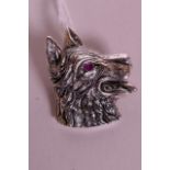 A 925 silver brooch in the form of a dog, with ruby set eyes, 1" long