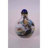 A Chinese enamelled Peking glass snuff bottle decorated with a dog and fox, 2 character mark to