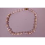 A baroque pearl necklace, 19" long