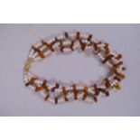 A triple strand pearl and Baltic amber necklace, 15" long