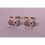 A pair of silver and enamel cufflinks in the form of dice