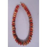 An apple coral bead necklace, 15½" long