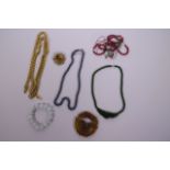 A small collection of costume jewellery, to include beaded necklaces, brooches, pendants etc