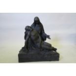 A Victorian patinated bronze figure group of the Pieta, 25" high