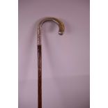 A Continental silver handled bamboo walking cane with chased and engraved handle, 35" long, A/F