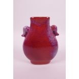 A Chinese flambé glazed pottery vase with twin elephant mask handles, impressed seal mark to base,