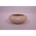 A Chinese beige ground ribbed porcelain bowl, raised seal mark to base, 5" diameter