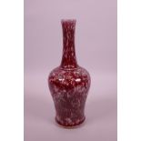 A Chinese red and green glazed porcelain vase with slender neck, 9" high