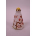 A Chinese white glass snuff bottle of hexagonal form with enamelled prunus blossom decoration, 3"