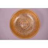 A Turkish gilt copper hammam spa bowl with repoussé foliate decoration, 7" diameter