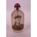 A Chinese reverse painted glass snuff bottle decorated with the portrait of an emperor, character