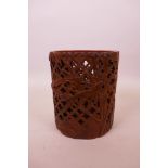 A Chinese carved and pierced bamboo brush pot with bamboo decoration, 5½" high