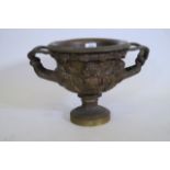 A bronze urn after the Warwick vase, 14" x 10" high