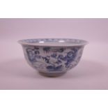 A Chinese blue and white porcelain rice bowl decorated with figures flying kites, 5½" diameter