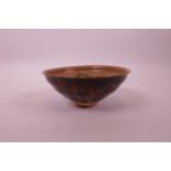 A Chinese Cizhou kiln pottery bowl with floral decoration to interior, 5½" diameter