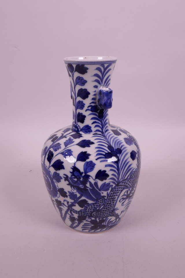 A Chinese blue and white porcelain vase with two lug handles, decorated with dragons and flowers, - Image 2 of 3