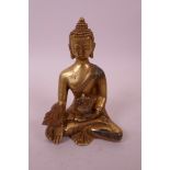 A Sino-Tibetan bronze of Buddha seated in the lotus position, double vajra mark to base, 4" high