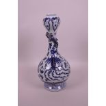 A Chinese blue and white porcelain garlic head shaped vase decorated with applied dragon to neck and