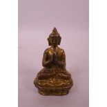 A small Sino-Tibetan gilt bronze Buddha, 3" high