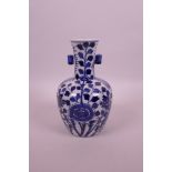 A Chinese blue and white porcelain vase with two lug handles, decorated with dragons and flowers,