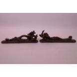 A pair of Chinese scroll weights in the form of a dragon and phoenix, 8½" long