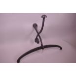 A cast metal coat hook embossed 'Hotel Paris'