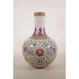 A Chinese polychrome enamelled porcelain vase decorated with lotus flowers and the emblems of The