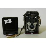 A Yashica-Mat camera with Yashinon lens in leather case