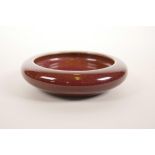 A Chinese flambé glazed pottery ink dish, 4" diameter