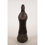 A Chinese red ware pottery figure of Quan Yin atop a mythical beast, impressed seal mark to base,