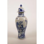 An early C20th Chinese blue and white jar and cover, decorated with women and children in a