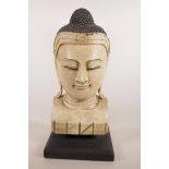 A carved and painted wood Buddha head, 19" high