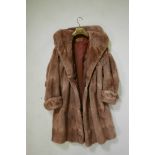 A lady's Musquash fur coat by 'Faukes Furriers, Birmingham', 39" long