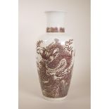 A large Chinese red and white pottery vase decorated with a dragon chasing the flaming pearl, 6