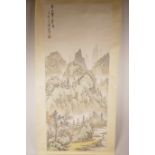 A Chinese watercolour scroll depicting a mountainous landscape with figures and a river, 15½" x 36½"