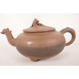 A Chinese Yixing red earthenware teapot of squat form with geometric banded decoration to body