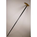 A horn handled walking stick with a gold plated cuff, 36" long